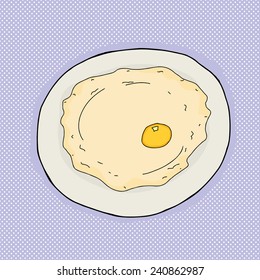 Single large fried egg in plate over blue