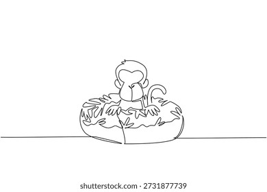 Single line drawing of monkey features adorable playful animal sitting inside sweet donut for fancy bakery concept. Minimalist design represents international food day theme for kids event decoration