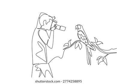 Single line drawing shows a handsome young man photographing a parrot in public garden. This impressive animal concept is brilliantly suited for Nature Photography Day articles and wildlife posters.