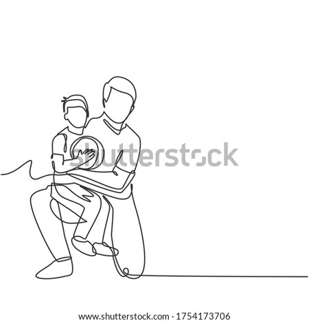 Single line drawing of young happy father hugging her child that carried a basket ball on basketball court. Parenting family concept. Modern continuous line draw design vector graphic illustration