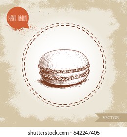 Single macaron cookie on vintage old background. Delicious french pastry sweet. Hand drawn sketch style vector illustration.