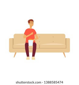 Single man sitting on couch with popcorn cartoon style, vector illustration isolated on white background. Male sitting alone on home sofa snacking and watching movie or tv