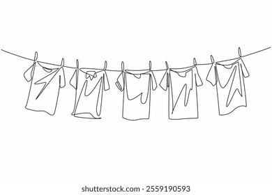 Single one line drawing 5 colorful t-shirts are drying on the clothesline. Adding brightness to the morning when drying. Laundry. National Hanging Out Day. Continuous line design graphic illustration