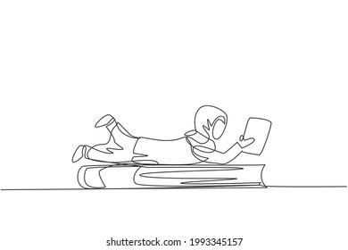 Single one line drawing Arab little girl reading, learning and laying down on big book. Study at home. Smart student, education concept. Modern continuous line draw design graphic vector illustration