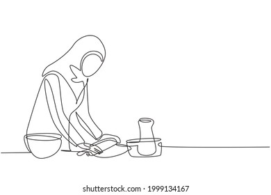 Single one line drawing Arab woman making cookie dough using rolling pin at cozy kitchen table. Making bakery and homemade pizza at home. Modern continuous line draw design graphic vector illustration