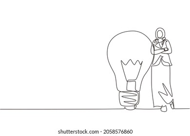 Single one line drawing Arab businesswoman leaning on giant lightbulb. Business people have ideas leaning against the lamp symbol is good idea. Continuous line draw design graphic vector illustration
