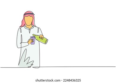 Single one line drawing Arab male pouring orange juice into glass from bottle while having breakfast at home. Healthy lifestyle concept. Modern continuous line draw design graphic vector illustration
