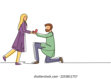 Single one line drawing Arab man kneeling offering engagement ring to his girlfriend. Young guy on knees proposing girl to marry. Marriage proposal concept. Continuous line draw design graphic vector