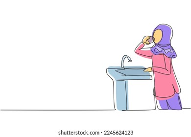 Single one line drawing Arabian girl drinking water from ready-to-drink faucet. Thirst and dehydration due to heat during the day. Fresh moment. Continuous line draw design graphic vector illustration