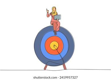 Single one line drawing of Arabian businesswoman sitting on giant arrow target board while holding laptop computer. Invites to focus on pursuing business report targets. Continuous line design graphic