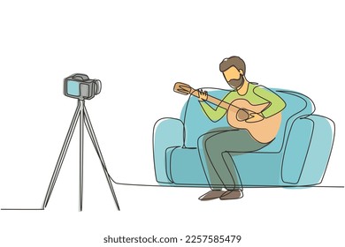 Single one line drawing Arabic man recording video of his playing guitar by camera on tripod. Male vlogger influencer performing music for show to streaming digital. Continuous line draw design vector