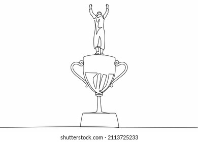 Single one line drawing back view businessman stand above trophy. Business metaphor of success and appreciation. Arabian male celebrating his business award. Continuous line draw design graphic vector