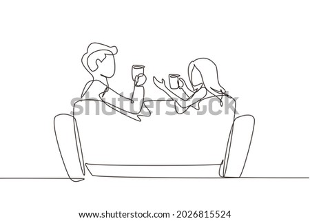 Single one line drawing back view romantic couple sitting at sofa, talking and drinking coffee. Man and woman have relaxing day off. Stay at home. Modern continuous line draw design graphic vector