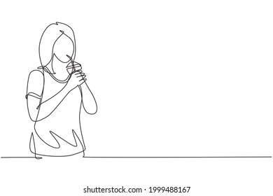 Single one line drawing beautiful woman hold plastic cup and drinking orange juice with straw. Make her refreshing in summer season. Modern continuous line draw design graphic vector illustration