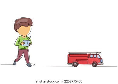 Single one line drawing boy playing with remote-controlled fire truck toy. Cute kids playing with electronic toy fire truck with remote control in hands. Continuous line draw design graphic vector