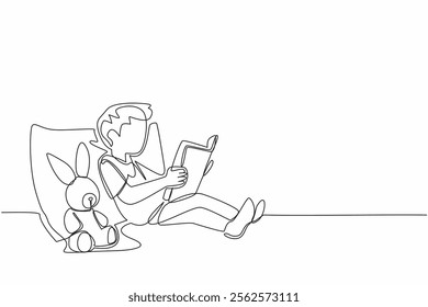 Single one line drawing boy leaning on pillow reading story book to bunny doll. A tale of friendship between rabbits. Myth. National Tell a Story Day. Continuous line design graphic illustration