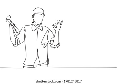 Single one line drawing of carpenter with gesture okay works in his workshop making wooden products. Skills in using carpentry tools. Modern continuous line draw design graphic vector illustration