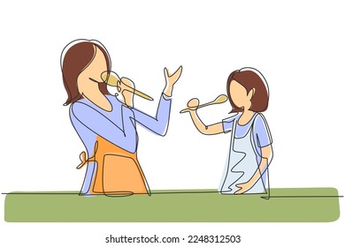Single one line drawing cheerful mom and her little daughter singing while cooking together, using spatula and broccoli as microphones. Modern continuous line draw design graphic vector illustration