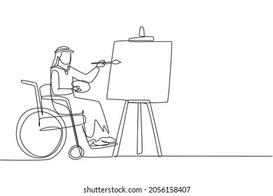 Single one line drawing disabled Arab man in wheelchair painting landscape on canvas. Rehabilitation physiotherapy concept. Physical disability. Continuous line draw design graphic vector illustration