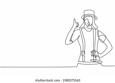 Single one line drawing of female mime artist with thumbs-up gesture and white face make-up puts on a silent motion comedy show at circus arena. Continuous line draw design graphic vector illustration