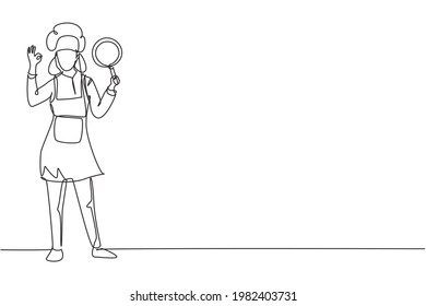 Single one line drawing female chef stands with gesture okay, holding pan and wear apron prepares ingredients to cook the best dishes. Modern continuous line draw design graphic vector illustration