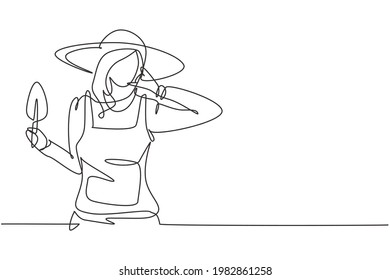 Single one line drawing female farmer with call me gesture wearing straw hat and carrying mini shovel to work on the farm. Success business. Continuous line draw design graphic vector illustration