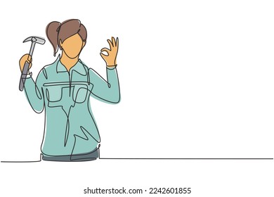 Single one line drawing female carpenter with gesture okay works in his workshop making wooden products. Skills in using carpentry tools. Modern continuous line draw design graphic vector illustration