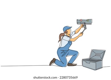 Single one line drawing female plumber in overall is installing water heater or boiler. Home repair, maintenance and plumbing services. Handywoman concept. Continuous line draw design graphic vector