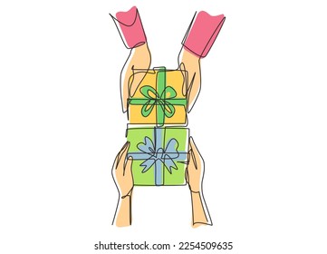 Single one line drawing gives gift new year presents laid on wooden table background. Birthday presents cardboard box with ribbon bow. Modern continuous line draw design graphic vector illustration