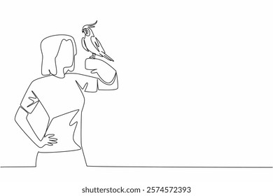 Single one line drawing grey cockatiel perched on hand of woman. Bird with characteristic crest on its head. A gentle and loving animal. Woman Holding Bird. Continuous line design graphic illustration