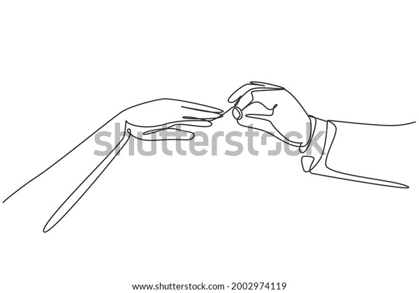 Single one line drawing groom puts ring on finger\
of bride. Bride and groom make vow of loyalty on their wedding day.\
Marriage ceremony celebration concept. Modern continuous line draw\
design graphic