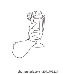 Single one line drawing hand holds glass milkshake with whipped cream. Cold soft drink for summer. Sweet beverage. Tasty and yummy fast food. Continuous line draw design graphic vector illustration