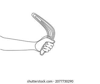 Single one line drawing hand holding boomerang, ancient aboriginal hunting tool from Australia. Traditional souvenir, Australian native symbols. Continuous line draw design graphic vector illustration