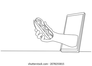 Single one line drawing hand holding hotdog through mobile phone. Concept of restaurant order delivery online food. Application for smartphones. Continuous line draw design graphic vector illustration