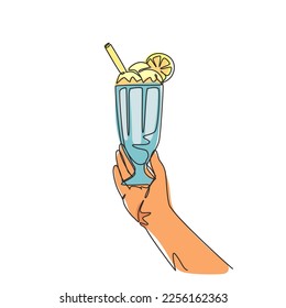 Single one line drawing hand holds a big glass with a milkshake with a whipped cream, with a straw and slice of orange. Sweet beverage. Modern continuous line draw design graphic vector illustration