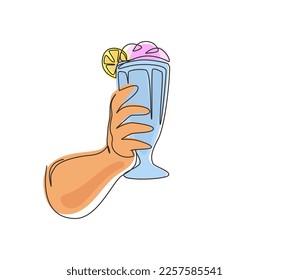 Single one line drawing hand holds glass milkshake with whipped cream. Cold soft drink for summer. Sweet beverage. Tasty and yummy fast food. Continuous line draw design graphic vector illustration