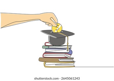 Single one line drawing hand holds coin inserting them into graduation cap and pile of thick books underneath. Serious about education. College Savings Day. Continuous line design graphic illustration