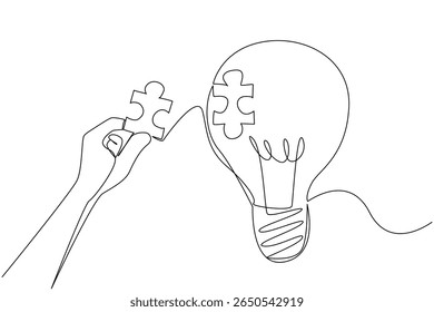 Single one line drawing hand holds puzzle piece and wants to stick it to the surface of hollow bulb. Patching the void of thought. National Creativity Day. Continuous line design graphic illustration