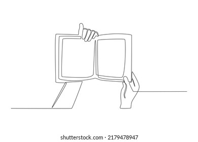 Single one line drawing hands holding open book. Books lovers day concept. Single line draw design vector graphic illustration.