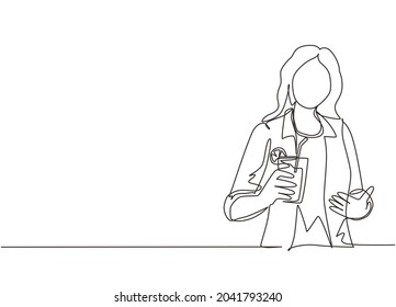 Single one line drawing happy woman showing summer refreshing fruit flavored infused water with fresh organic lemon, lime, mint at glass. Relax time. Continuous line draw design vector illustration