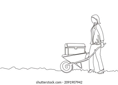 Single one line drawing happy businesswoman in blazer pushing cart with treasure chest. Wheelbarrow with gold, jewelry, treasures. Business, finance concept. Continuous line draw design graphic vector