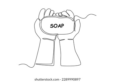 Single one line drawing happy kids hand holding soap. Bathroom activities concept. Continuous line draw design graphic vector illustration.