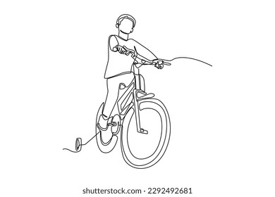 Single one line drawing happy boy riding a bike with helmet. World bicycle day concept. Continuous line draw design graphic vector illustration.