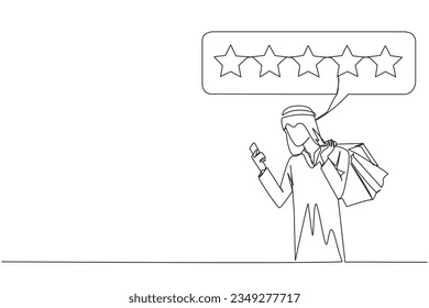 Single one line drawing happy Arabian man holding several shopping bags. The other hand typing on the smartphone gives a 5 star review. Online shopping. Continuous line design graphic illustration