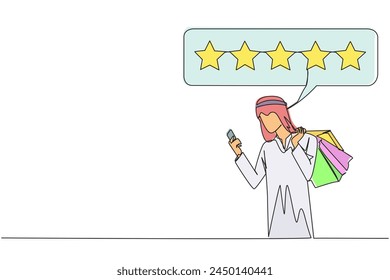 Single one line drawing happy Arabian man holding several shopping bags. The other hand typing on the smartphone gives a 5 star review. Online shopping. Continuous line design graphic illustration