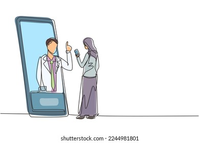 Single one line drawing hijab female patient holding smartphone standing facing giant smartphone and consulting male doctor. Doctor online. Continuous line draw design graphic vector illustration