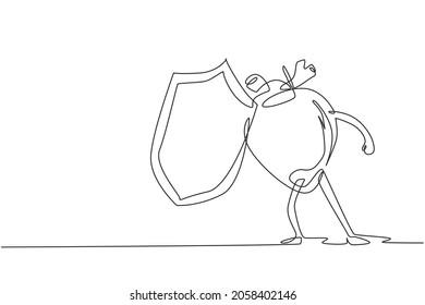 Single one line drawing human heart organ mascot holding shield for protection. Health of cardiovascular system. Power and strength of heart organ. Continuous line draw design vector illustration