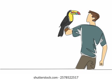 Single one line drawing keel billed toucan perched on hand of man. This species is found in tropical forests. Eat insects or fruit. Pets. Man Holding Bird. Continuous line design graphic illustration