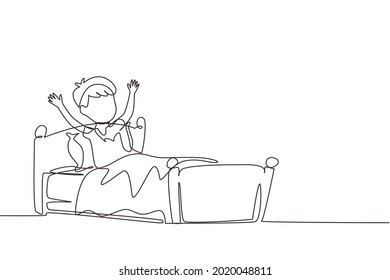 Single one line drawing little boy wake up and still yawning, still lying in bed under blanket. Sleepy child on bed in late weekend morning. Continuous line draw design graphic vector illustration