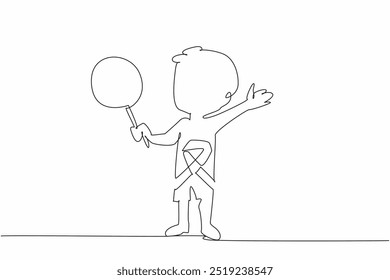 Single one line drawing a little boy holding lollipop stands with arms outstretched. Innocence. Imagination. Survivor. International Childhood Cancer Day. Continuous line design graphic illustration